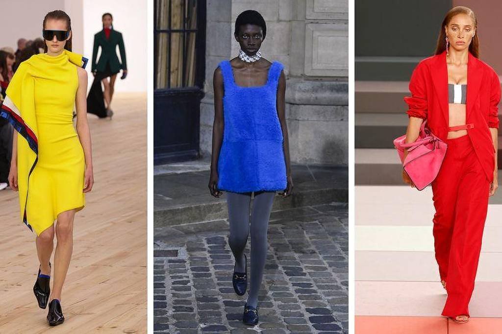 Três modelos exibem roupas vibrantes em diferentes passarelas: à esquerda, vestido amarelo com detalhe assimétrico e óculos escuros; ao centro, vestido azul texturizado com calça cinza e colar prateado; à direita, conjunto vermelho com top branco e bolsa rosa.